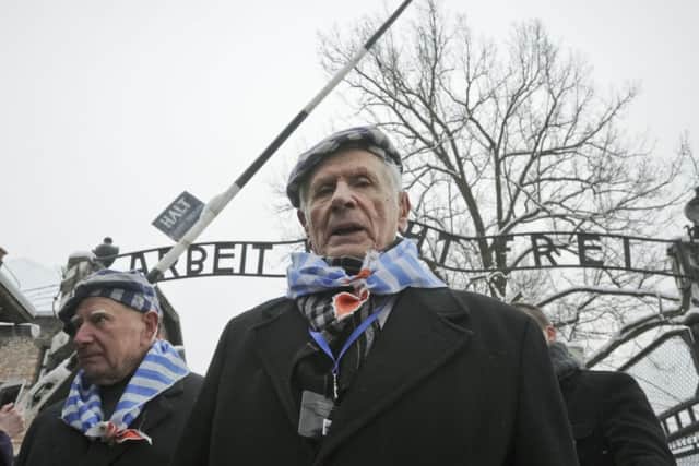Holocaust Memorial day has been marked at the gate of the of the Auschwitz Nazi death camp in Oswiecim, and around the world.