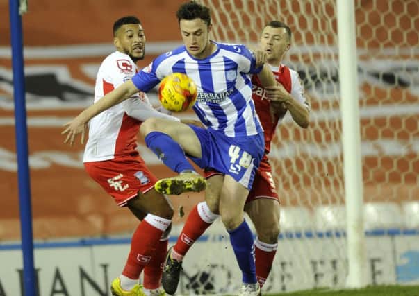Loan recruit Will Keane,  making his Sheffield Wednesday debut, fights for possession (Picture: Steve Ellis).