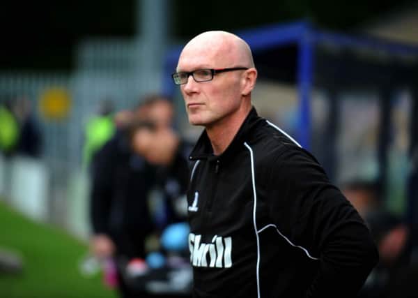 Town's manager Neil Aspin.