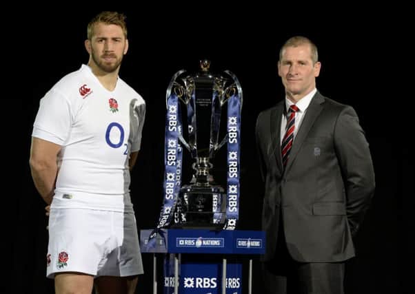 England captain Chris Robshaw and head coach Stuart Lancaster pose with the new 6 Nations Trophy during the RBS Six Nations Launch at the Hurlingham Club, London.
