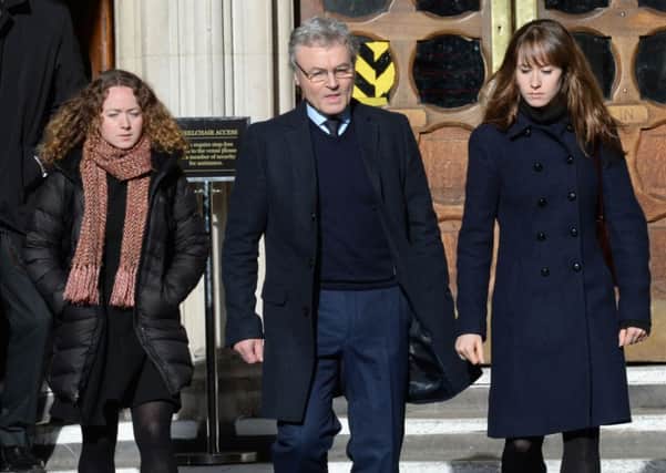 The family of teacher Ann Maguire, (left to right) daughter Kelly, husband Don and other daughter Emma, leave the High Court in London where  Will Cornick lost a challenge to his 20-year minimum term for her murder. PIC: PA