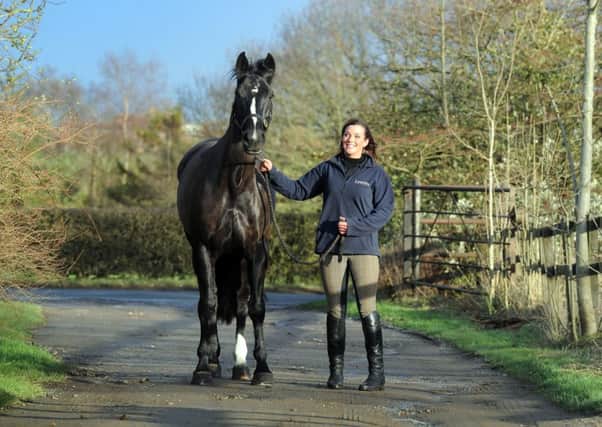 AIMING HIGH: Hazel Towers, 27, of Harrogate, with her horse Simply Smart. Picture: James Hardisty.