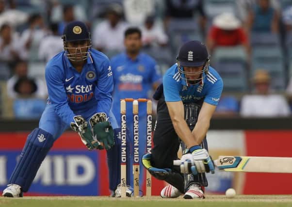England's Jos Butler, right, plays a stroke during England's one day international cricket match against India in Perth. (AP Photo/Theron Kirkman)