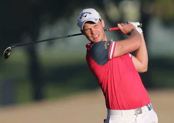 Danny Willett of England plays a shot on the 10th hole during the round two of the Dubai Desert Classic golf tournament in Dubai. (AP Photo/Kamran Jebreili)