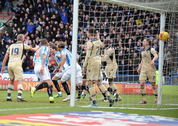 Huddersfield Town's Harry Bunn celebrates his goal to make it 1-1.