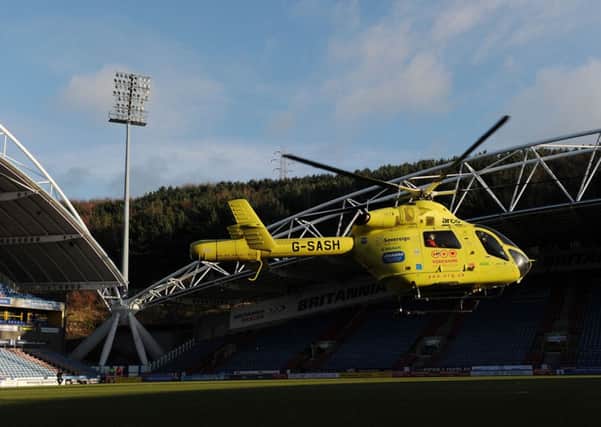 Huddersfield Town's Tommy Smith is taken away in the air ambulance after the Sky Bet Championship match at the John Smith's Stadium, Huddersfield.