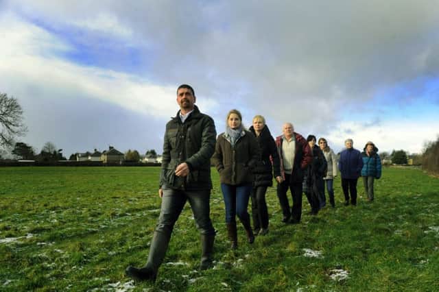 29/1/15 Nick Sefton leads a group of  local residents who are opposing  the proposed housing development at Killinghall near Harrogate along a public footpath on the edge of one of the  fields that will be built on .(GL1004/77e)