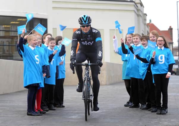 Ben Swift cyles through children fron Scalby and East Ayton school, Scarborough, at the launch of the Tour de Yorkshire, one of his big targets for the season. (Picture: Simon Hulme).