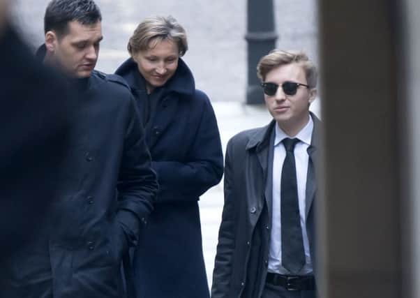 Anatoly Litvinenko (right) arrives with mother Marina Litvinenko at the Royal Courts of Justice