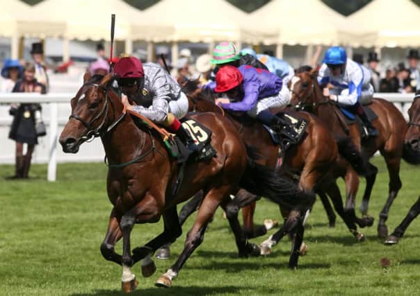 The Wow Signal and Frankie Dettori win the Coventry Stakes during  the 2014 Royal Ascot meeting. Picture: Steve Parsons/PA.
