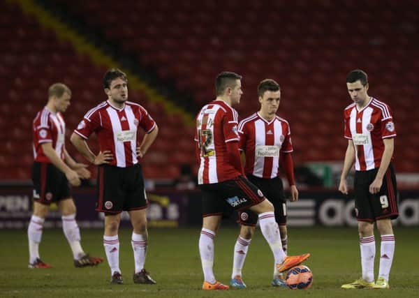 Dejected Sheffield United players.