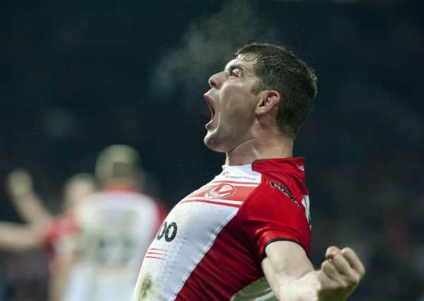 FINALLY: Paul Wellens celebrates as St Helens defeat Wigan to win Super Leagues Grand Final for the first time in six attempts at Old Trafford last season.