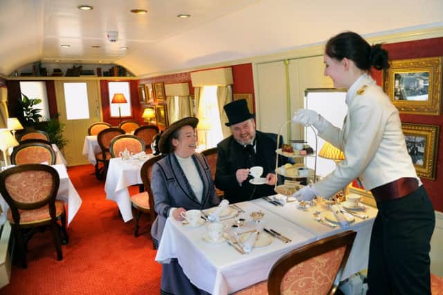 Julie O'Connell and Patrick Smith from the Platform 4 Theatre company  taking afternoon tea on the newly opened 'Countess of York'  at the National Railway Museum in York