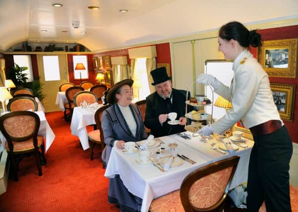 Julie O'Connell and Patrick Smith from the Platform 4 Theatre company  taking afternoon tea on the newly opened 'Countess of York'  at the National Railway Museum in York