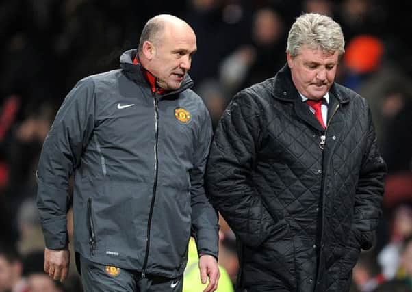 Former Manchester United team-mates Mike Phelan, left, and Steve Bruce have been reunited at Hull City (Picture: Martin Rickett/PA Wire).