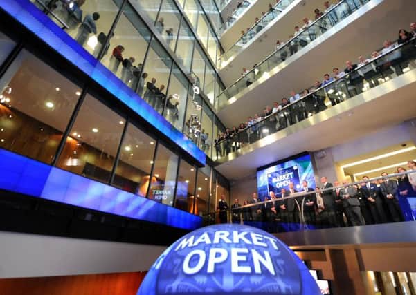 People at the London Stock Exchange watch the new 'Market Open Ceremony'.