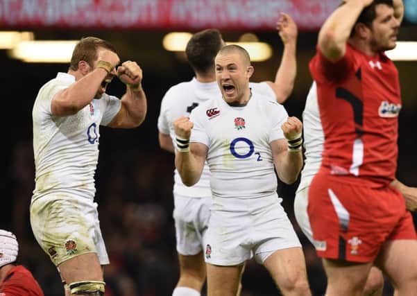 SOLID START: England's Chris Robshaw (left) and Mike Brown (centre) celebrate in Cardiff.