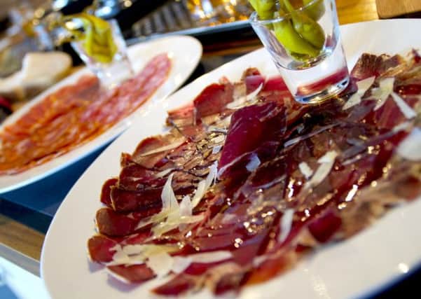 The Record Cafe serves plates of Spanish cured pork.