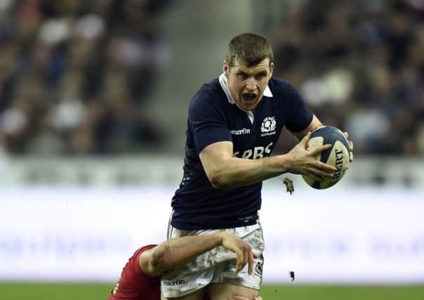Scotland's Mark Bennett is tackled by France's Remy Lamerat