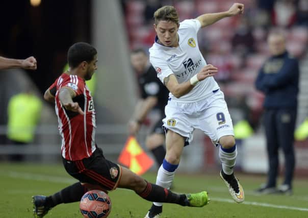 Sunderland's Liam Bridcutt (left) and Leeds United's Adryan during the FA Cup, Third Round match