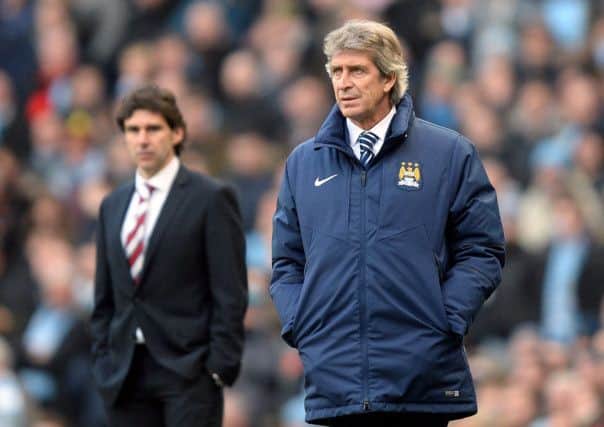 Middlesbrough head coach Aitor Karanka, left, has refuted Manchester City manager Manuel Pellegrini's accusations about Boro playing defensively (Picture: Martin Rickett/PA Wire).