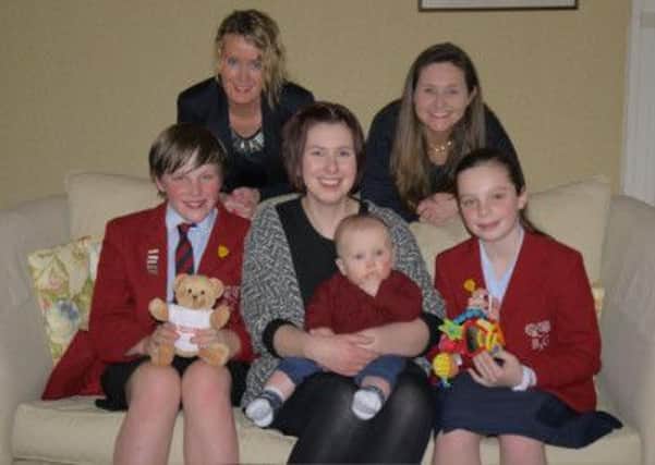Rebecca Hartley and her son Jack help launch school fundraising drive.