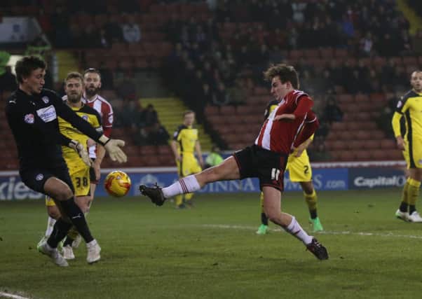 Jose Baxter fires Sheffield United in front against Colchester.