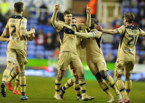 ON TARGET: Leeds Uniteds Luke Murphy and his team-mates celebrate his goal at Reading last night in the Championship. Picture: Bruce Rollinson