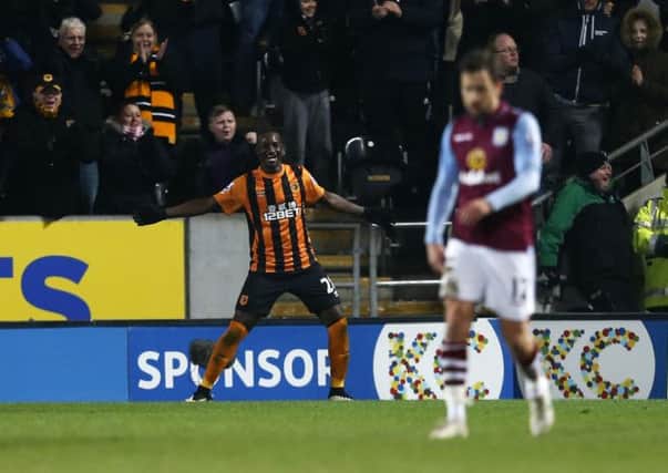 TIGER FEET: Hull City's Dame N'Doye celebrates scoring his sides second goal against Aston Villa. Picture: Lynne Cameron/PA.