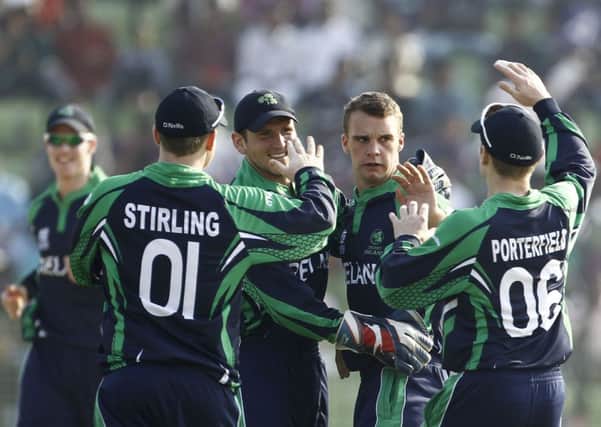 Ireland's Andy McBrine, second right, celebrates with teammates the dismissal of Zimbabwe's Sean Williams during their ICC Twenty20 Cricket World Cup match against Zimbabwe in Sylhet, Bangladesh, Monday, March 17, 2014.