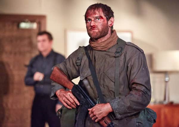 Mark Stanley as Soldier in Blasted.  Photograph by Mark Douet.