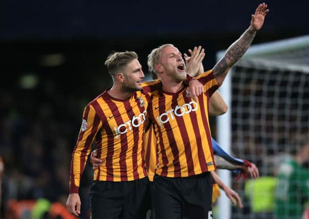 Gary Liddle, left, and Andrew Davies celebrate Bradford City's  magnificent FA Cup fourth-round victory over Chelsea at Stamford Bridge last month (Picture: John Walton/PA Wire).
