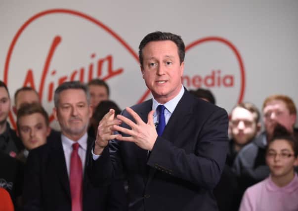 David Cameron addresses workers and apprentices during a visit to the Virgin Media training centre in Birmingham.