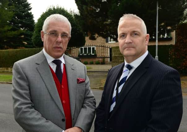 John Luper's brother Toby and Det Supt Simon Atkinson outside John's former home. Picture Scott Merrylees