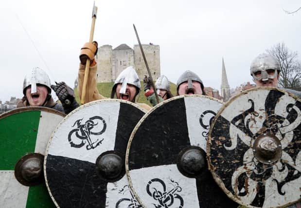 Viking re-enactors prepare for battle during the Jorvik Viking Festival, York. CREDIT PA Wire
