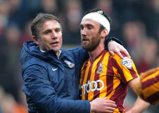 Phil Parkinson embraces defender Rory McArdle, whose performance in the win over Sunderland was described as exceptional by the Bradford City manager (Picture: Jonathan Gawthorpe).