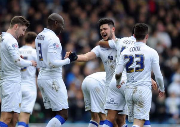 Leeds Uniteds Alex Mowatt, second right, is delighted after his shot deflected in for the match-winner against Millwall (Picture: Simon Hulme).