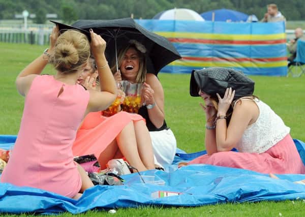 Women enjoying a picnic at Newcastle Racecourse