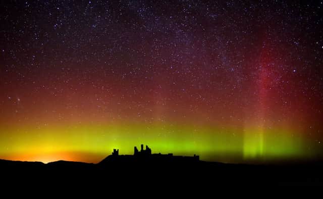 The aurora borealis, or the northern lights as they are commonly known at Dunstanburgh Castle in Northumberland. Picture: Owen Humphreys/PA Wire