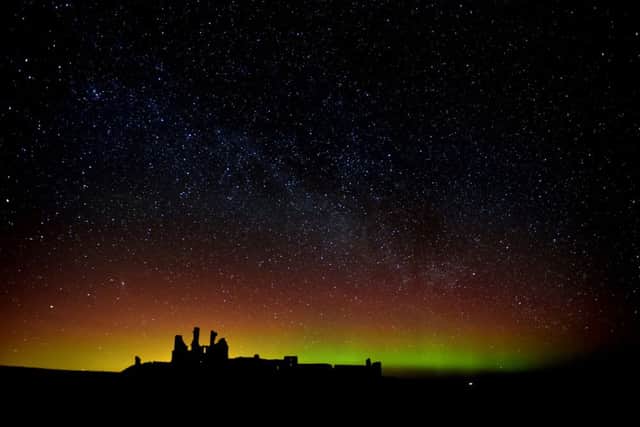The aurora borealis, or the northern lights as they are commonly known at Dunstanburgh Castle in Northumberland. Picture: Owen Humphreys/PA Wire