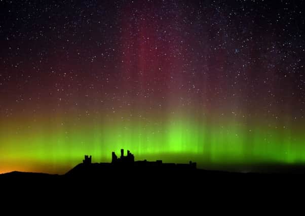 The aurora borealis, or the northern lights as they are commonly known at Dunstanburgh Castle in Northumberland.  Photo: Owen Humphreys/PA Wire