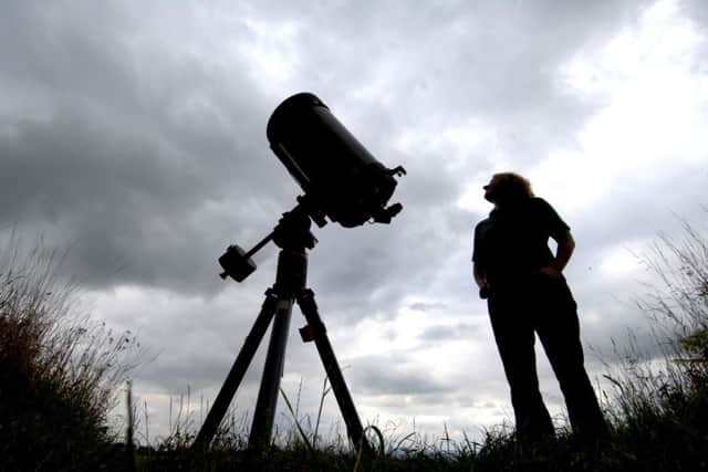 7th August 2009.

Nightwatch in dalby Forest.
Ranger Katie Thorn enjoys a sneak preview through a 14" telescope before the annual Nightwatch in Dalby Forest.
Picture by Gerard Binks
