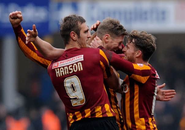 Bradford City's Jon Stead, centre, celebrates with James Hanson and Billy Clarke after scoring his side's second goal during the FA Cup defeat of Sunderland (Picture: Anna Gowthorpe/PA Wire).