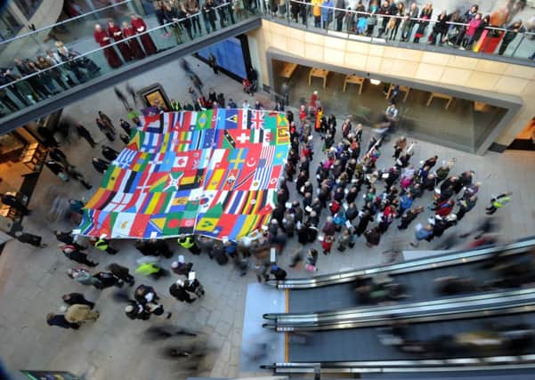 A flag is unveiled in the Trinity Shopping Centre, Leeds. Picture by Simon Hulme