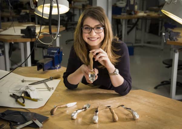 Charlotte Simmons with some of the ergonomic cutlery that she has designed to help people suffering from arthritis. Picture: Andrew Fox