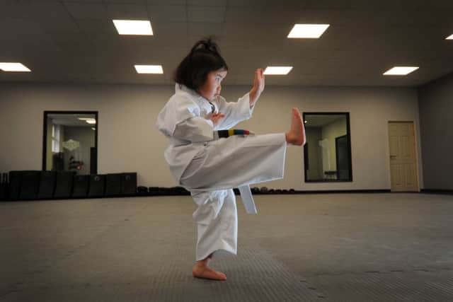 Three-year-old karate kid Sophie Wong, from Whinmoor, Leeds, pictured in action at Premier Martial Arts, in Armley, Leeds. Picture by Simon Hulme