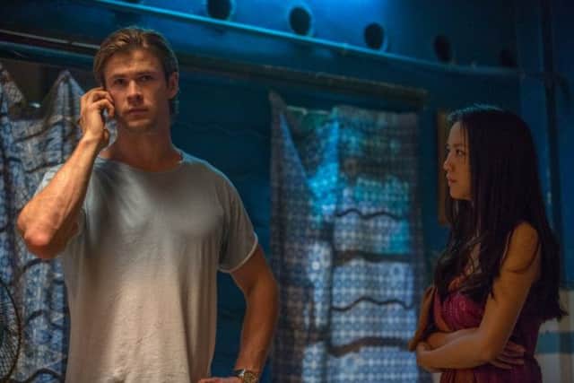 Chris Hemsworth as Nick Hathaway and Tang Wei as Chen Lien