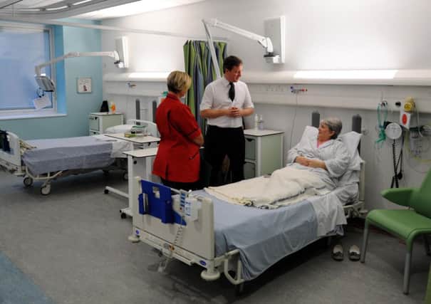 David Cameron meets a patient during a visit to the Royal Salford Hospital. The Prime Minister is a regular user of the NHS