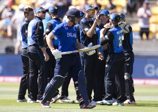 GONE: Yorkshire's Gary Ballance walks from the field as New Zealand players celebrate his dismissal . (AP Photo/NZ Herald,Mark Mitchell)