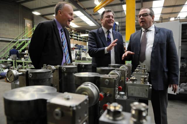 Ed Balls during his visit to Silsden manufacturer Advanced Actuators, with Labours parliamentary candidate for Keighley, John Grogan, and MD Chris Woodhead.